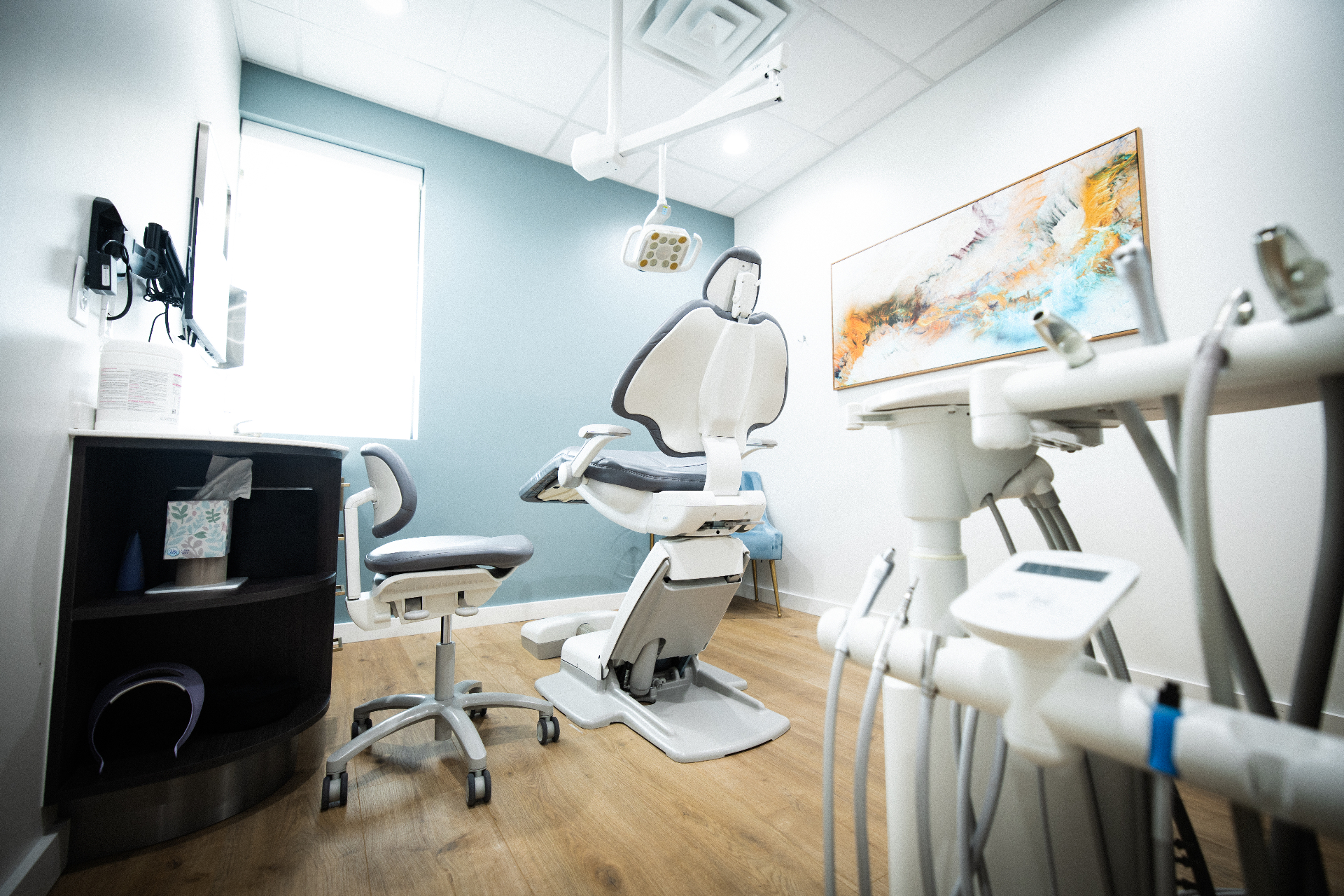 A calm, sunlit treatment room reflecting the practice's quality of care