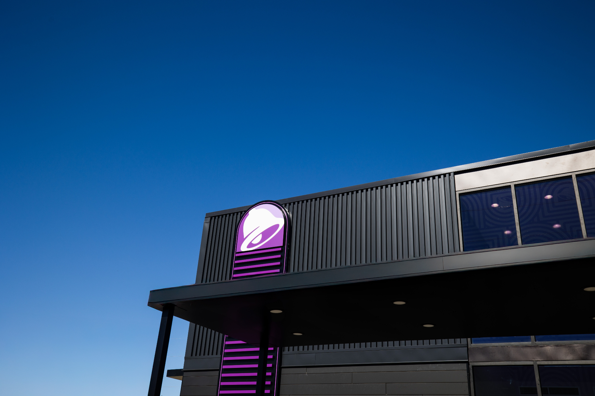 A completed retail exterior against deep blue sky